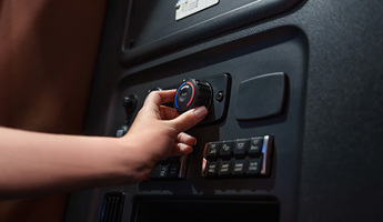 Digital key ignition system in commercial truck dashboard with terracotta interior trim